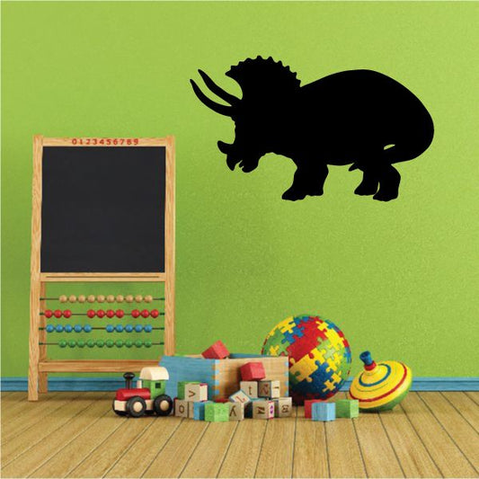 Triceratops wall decal featuring a black dinosaur silhouette
