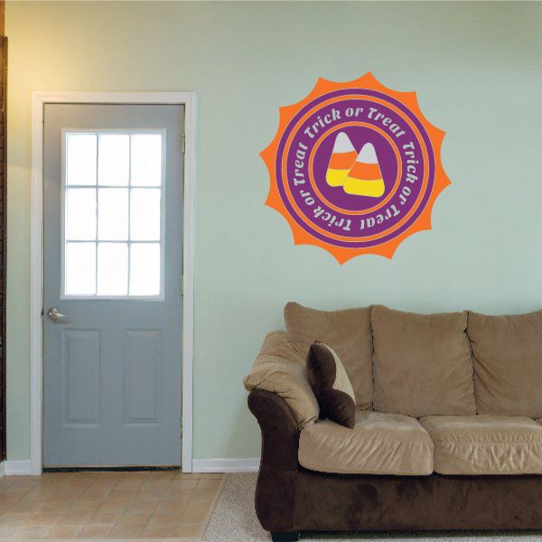 Halloween trick-or-treat seal sticker, orange badge with purple and yellow triangle icon