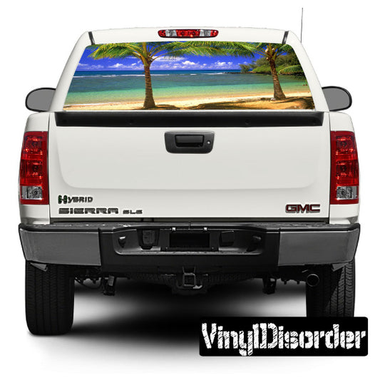 Tropical rear window graphic decal with beach and palm trees visible through glass