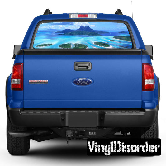 Blue pickup truck rear window tropical graphic view-through decal