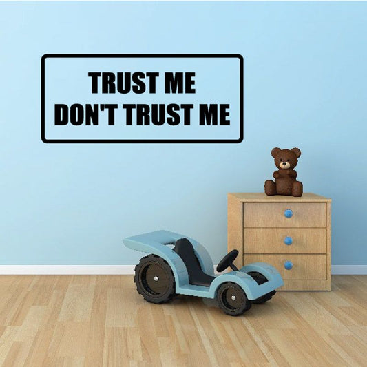 Rectangular wall decal with bold text: “TRUST ME” and “DON’T TRUST ME”.