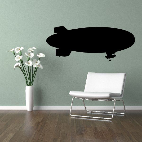 Unmanned dirigible wall decal, black blimp silhouette with small propeller details.