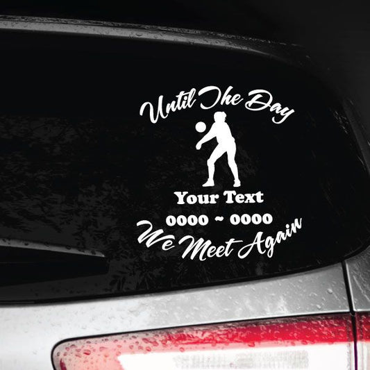 Car decal with white female volleyball silhouette and script memorial text on dark surface