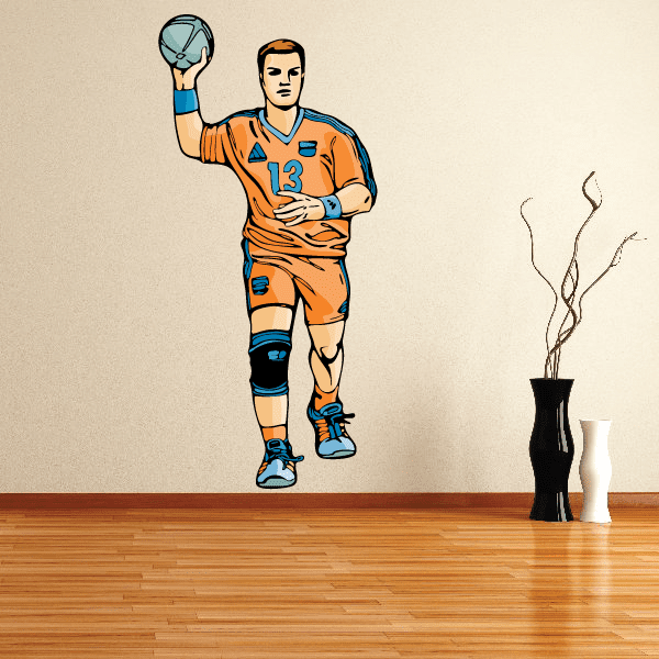 Volleyball player wall decal sticker with cartoon athlete in orange jersey holding a volleyball aloft