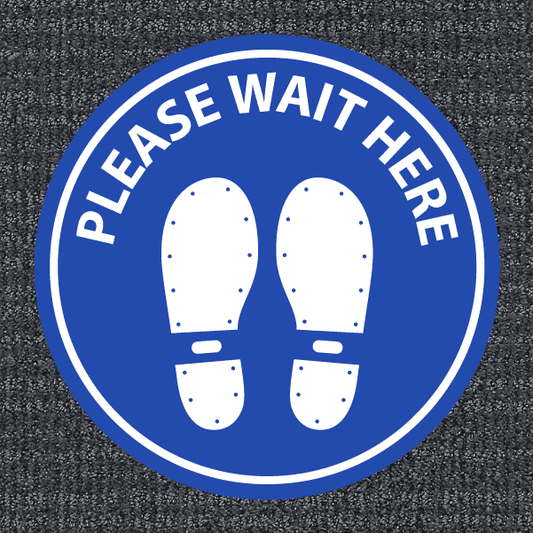 Blue round non-slip flooring sticker with 'PLEASE WAIT HERE' text and white feet icon