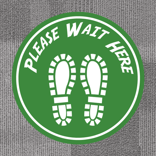 Green non-slip circular floor sticker: PLEASE WAIT HERE with shoe prints