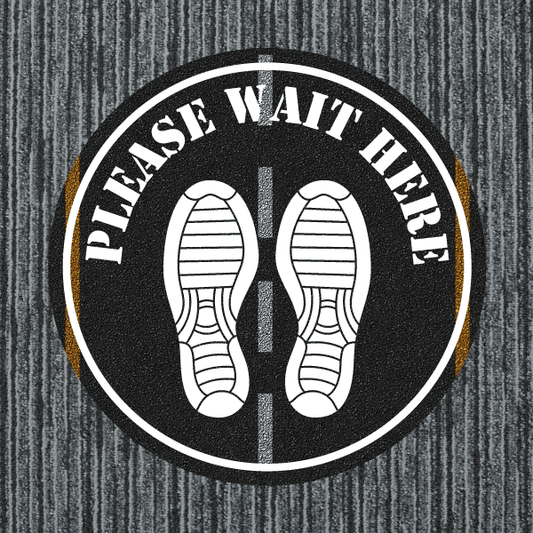 Round floor sticker with black background, white shoes, and 'Please Wait Here' text