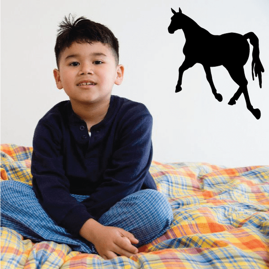 Black horse silhouette decal in a walking pose