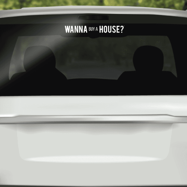 Vehicle window decal with white "WANNA BYA HOUSE?" lettering