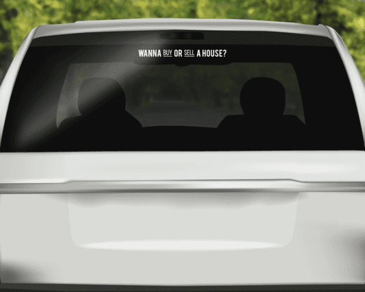 Horizontal rear window sign, black with text: "Wanna buy or sell a house?"