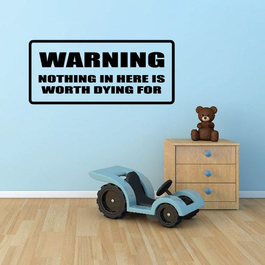Warning decal with black text "Nothing in here is worth dying for"