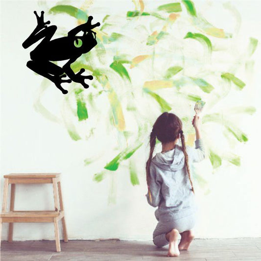 Tree frog wall decal with black frog silhouette and green leaf branches