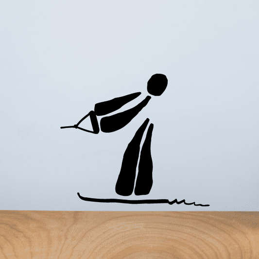 Water skiing illustration decal with black skier figure and wake lines