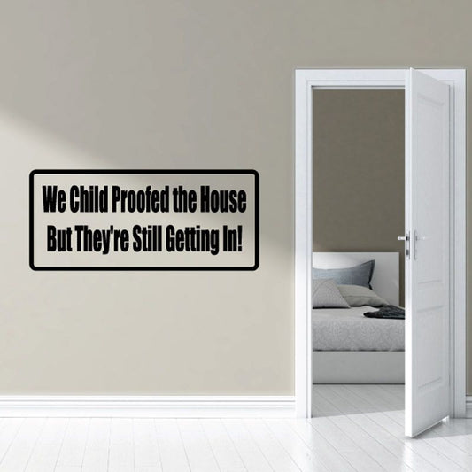 Vinyl wall decal with black border and white quote text: “We Child Proofed the House”