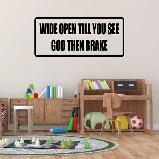 Rectangular wall decal with bold black and white text: wide open till you see god then brake