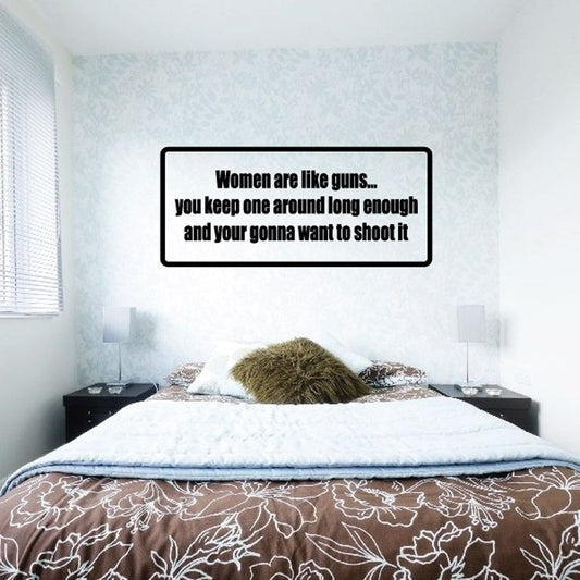 Black text wall decal reading “Women are like guns...” on white background.