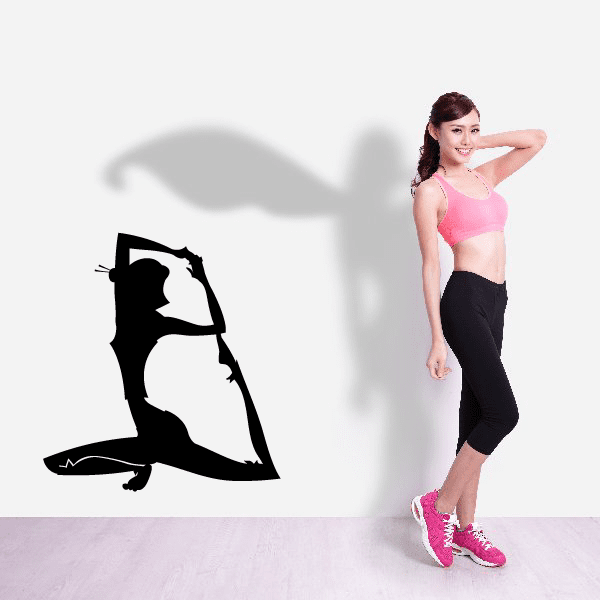 Black vinyl yoga wall decal with seated stretching figure silhouette