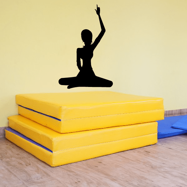 Yoga wall decal of seated woman raising one arm