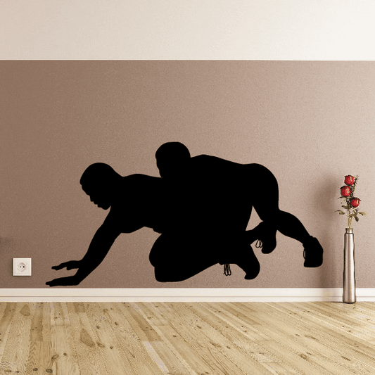 Wrestling decal of two silhouetted wrestlers in black