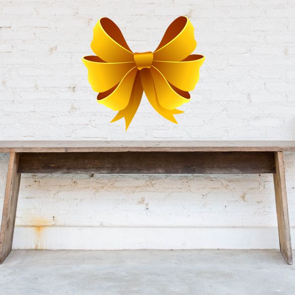 Yellow triple ribbon wall decal bow with curled tails, vinyl sticker