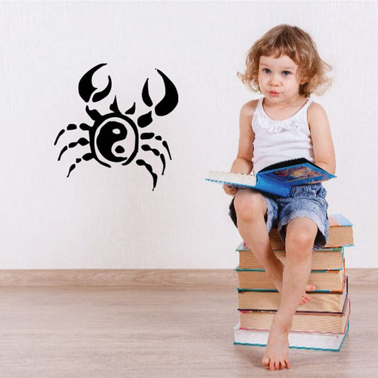 Black yin-yang crab wall decal with circular yin-yang pattern on shell