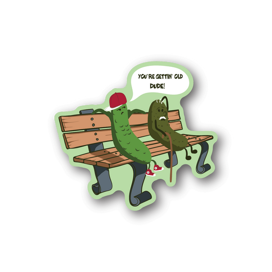 Vinyl sticker of two green pickles on a wooden bench with text in a speech bubble.