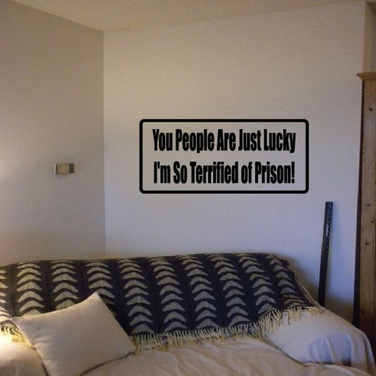 Rectangular wall decal with black border and text: You People Are Just Lucky