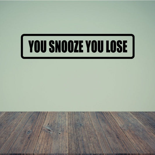 You snooze you loose wall decal with bold black border and white lettering