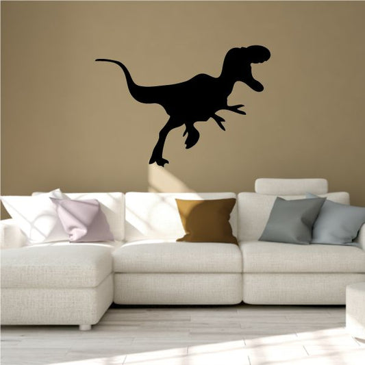 Black young T-Rex dinosaur silhouette decal with open-mouthed stance