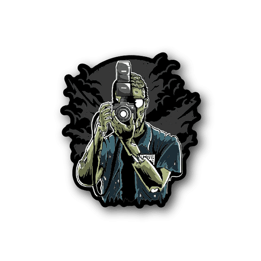 Zombie photographer vinyl sticker, zombie holding camera and wearing blue shirt