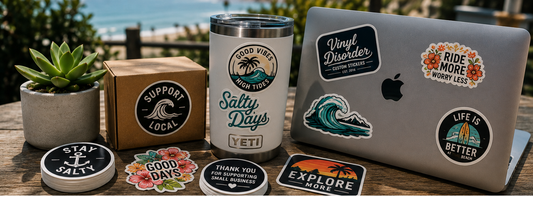 Custom vinyl sticker giveaway table with packaging, laptop stickers, water bottle stickers, and branded sticker stacks