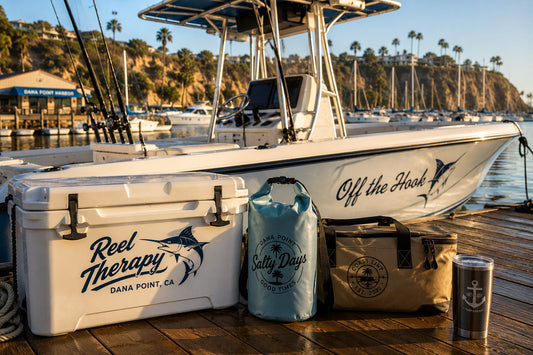 Golden-hour marina with a fictional center-console boat, cooler, dry bag, dock gear, and coordinated coastal decals