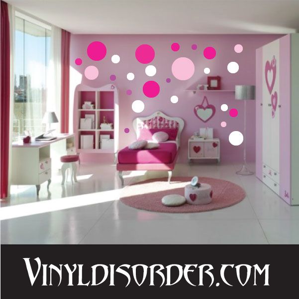 Circle wall decal kit with pink and white dot pattern on room wall