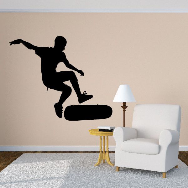 Skateboard trick wall decal with black silhouette of a 360 flip rider
