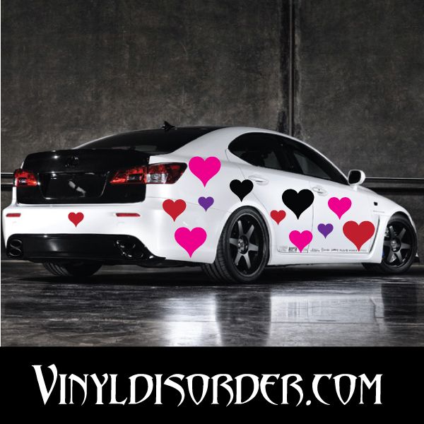 Vinyl heart decal set with pink, purple, and black hearts on a car