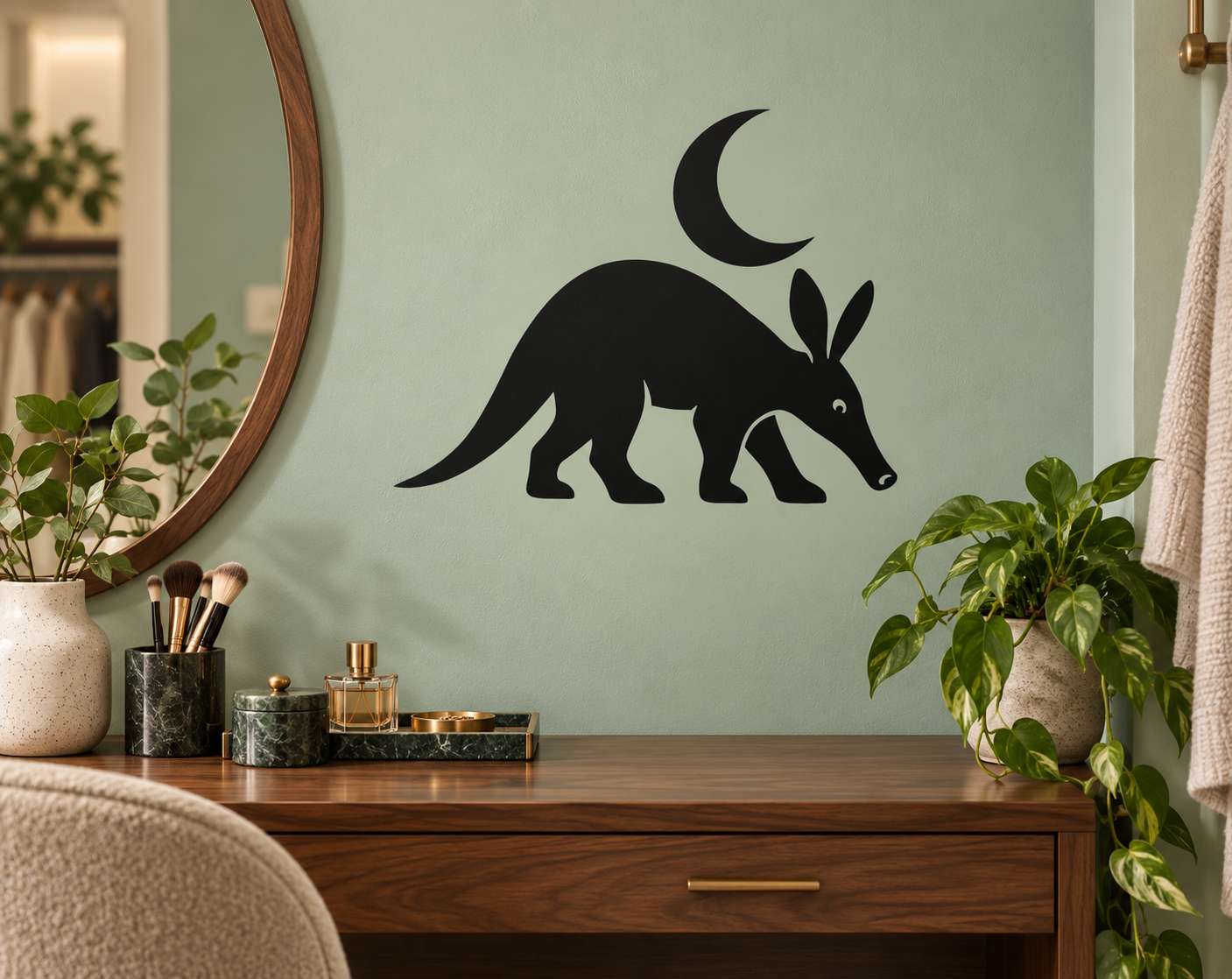 Black vinyl wall decal of aardvark with crescent moon and leaf accents