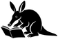 Close view of black aardvark reading vinyl decal with open book