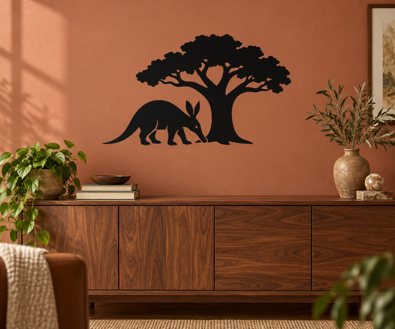 Black vinyl wall decal of a tree with a standing aardvark silhouette