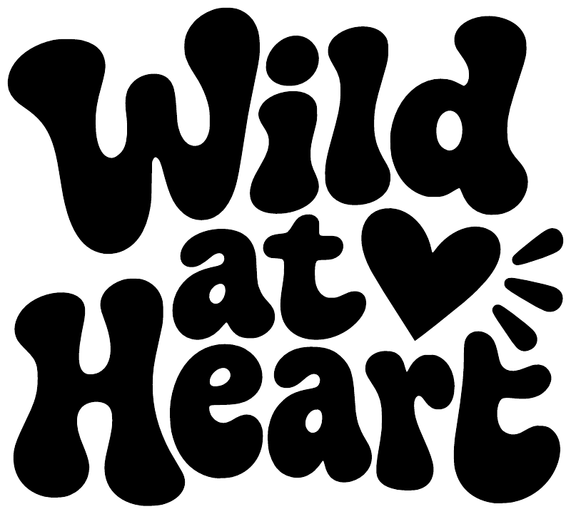 Black “Wild at Heart” lettering vinyl decal with heart and spark icons