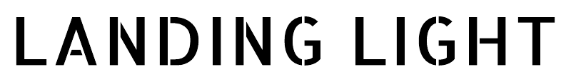 Landing light stencil text in white uppercase letters