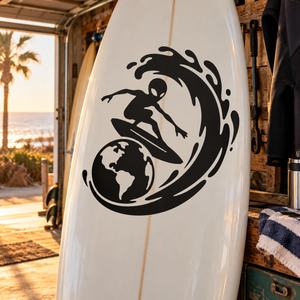 Alien surfer vinyl decal, black graphic on clear/white surface.