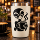 Alien vinyl decal: black character holding steaming coffee mug on a tumbler