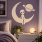 Alien vinyl wall decal with crescent moon, flying saucer planet, and Saturn ring