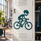 Teal alien cyclist vinyl decal sticker on a door panel