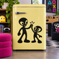 Alien vinyl decal with two black-and-white figures high-fiving on a light yellow surface