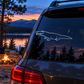 Alligator window decal with open jaw, ridged back outline, and small constellation spark cluster