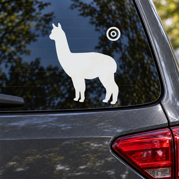 Standing white alpaca decal with upright ears and circular orbit halo on car window