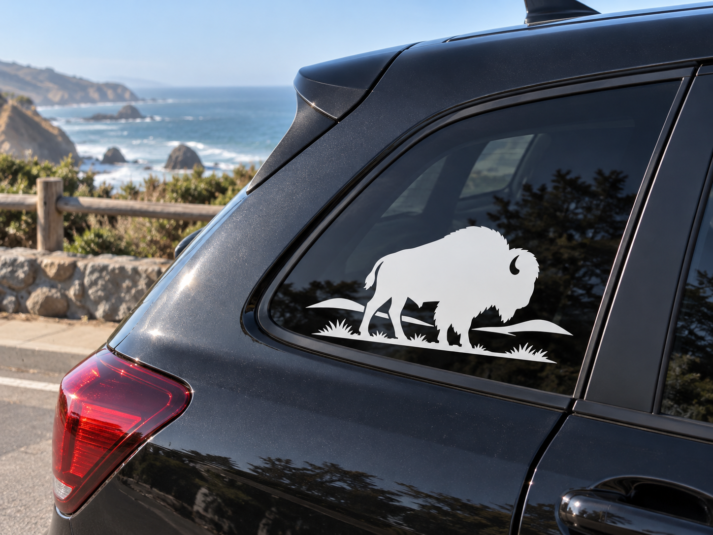 Prairie bison vinyl decal with grass silhouette on a car rear side window