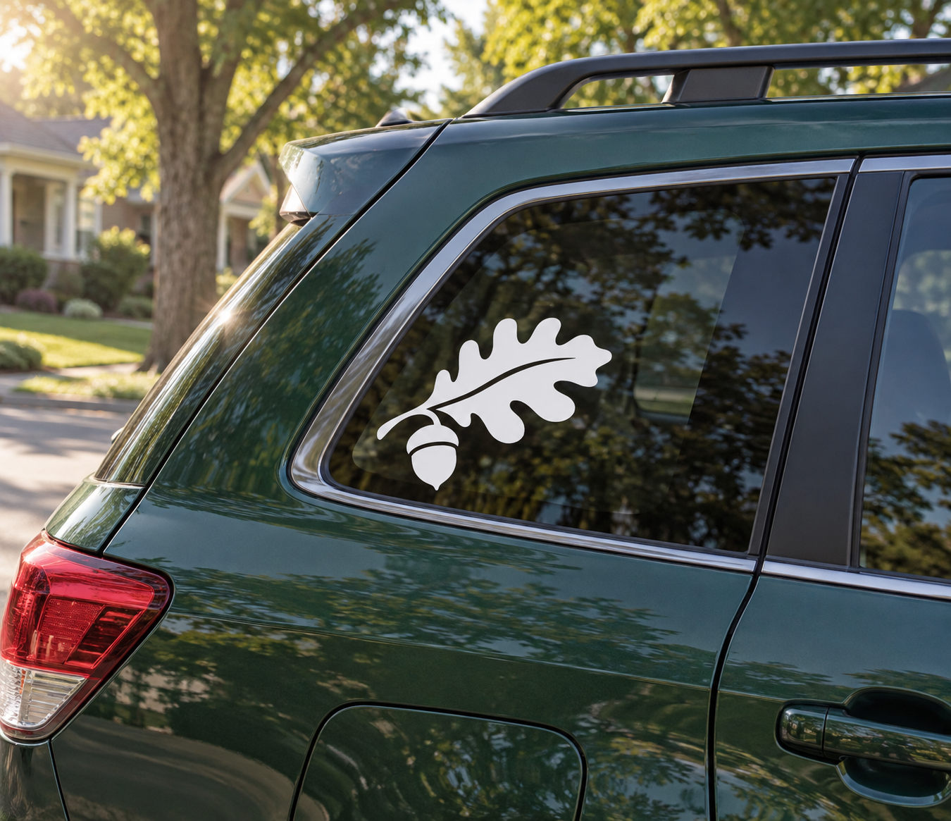 Oak and acorn vinyl decal in white, applied to car rear window
