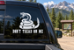 Rattlesnake vinyl decal with “DON’T TREAD ON ME” text on vehicle window